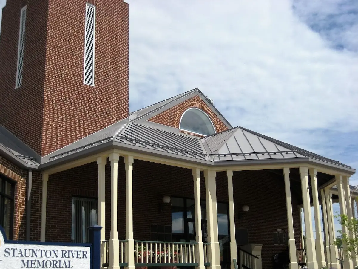 Skilled roofing craftsmen working on a residential roof in Downtown Paterson